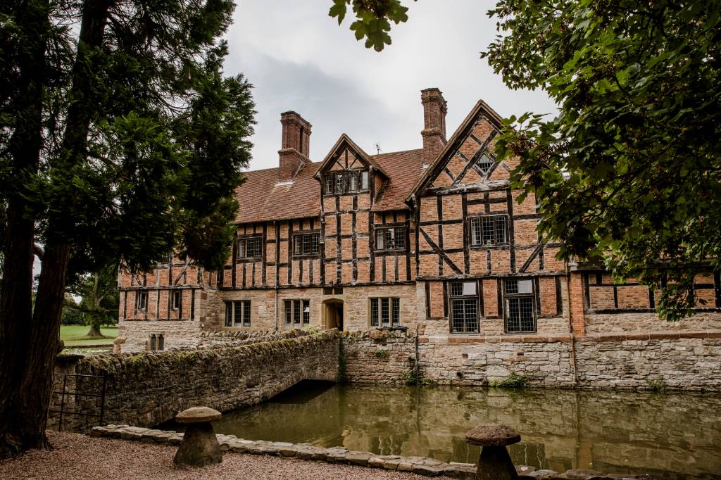 Birtsmorton Court reflected in the water