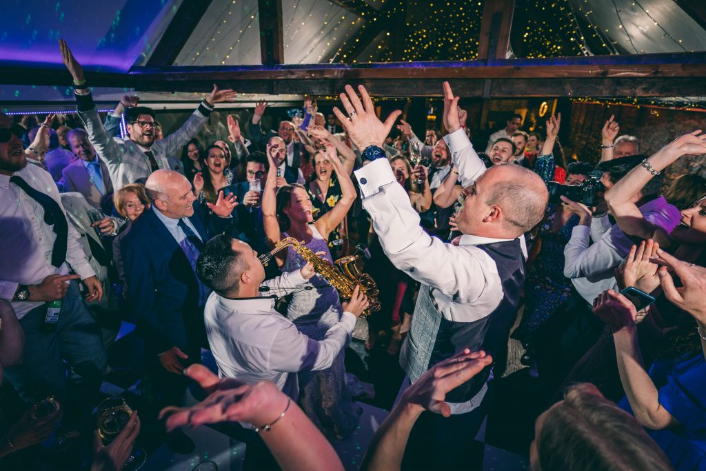 Guests dancing during an evening wedding party