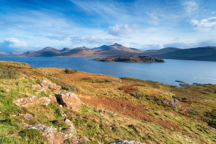 Scottish coastline with hills and calm blue water
